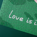 LOVE IS IN THE AIR Puslespil med 500 brikker – nærbillede af teksten LOVE IS IN THE AIR