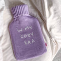 IN MY COZY ERA Varmedunk i lilla og naturgummi