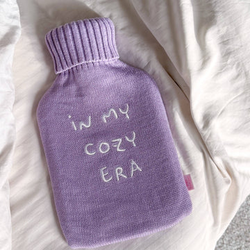 IN MY COZY ERA Varmedunk i lilla og naturgummi
