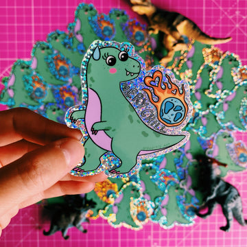 chill dinosaur klistermærke på laptop i hjemmekontor